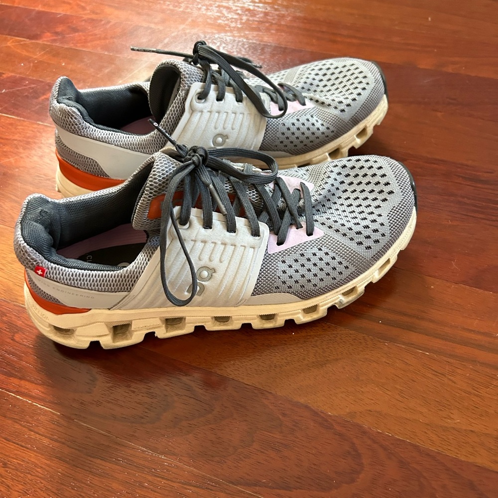 On Running Gray and Orange Athletic Shoes